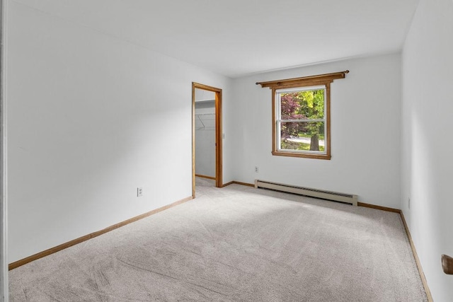26 Prospect St, Delhi, NY 13753 - carpeted empty room featuring a baseboard heating unit and baseboards