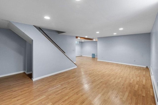 26 Prospect St, Delhi, NY 13753 - finished basement with light wood-style flooring, recessed lighting, baseboards, baseboard heating, and stairs