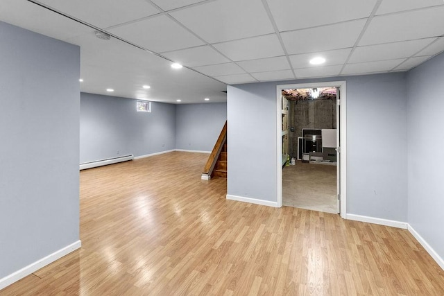 26 Prospect St, Delhi, NY 13753 - finished basement featuring a baseboard radiator, light wood-style floors, baseboards, stairway, and recessed lighting