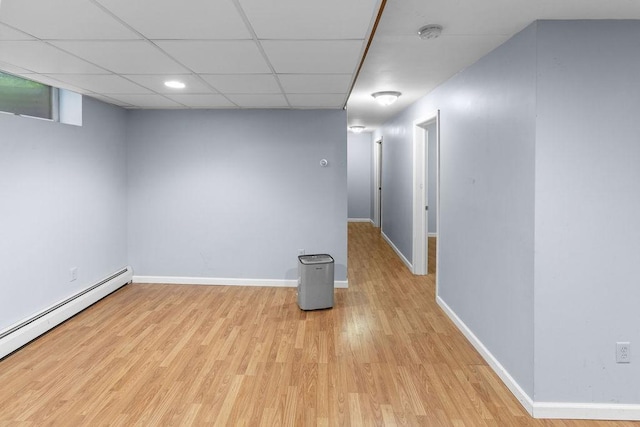 26 Prospect St, Delhi, NY 13753 - spare room with baseboard heating, light wood-style floors, a smoke detector, baseboards, and a paneled ceiling
