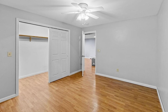 26 Prospect St, Delhi, NY 13753 - unfurnished bedroom featuring light wood-style flooring, baseboards, a closet, and a ceiling fan