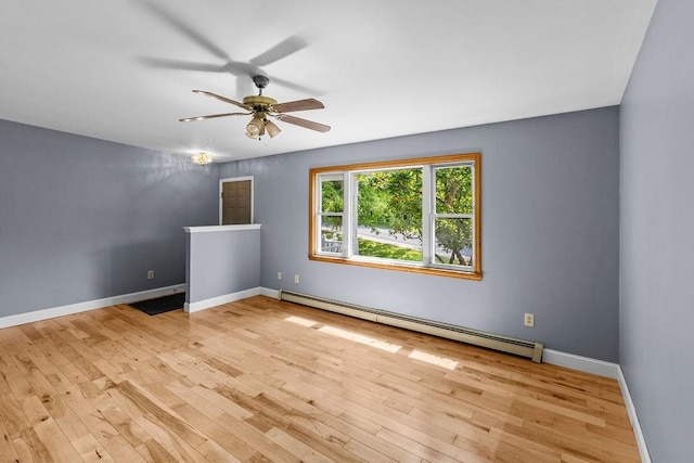 26 Prospect St, Delhi, NY 13753 - spare room with a baseboard heating unit, a ceiling fan, wood finished floors, and baseboards