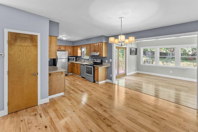 26 Prospect St, Delhi, NY 13753 - kitchen featuring stainless steel appliances, a chandelier, a sink, and light wood finished floors