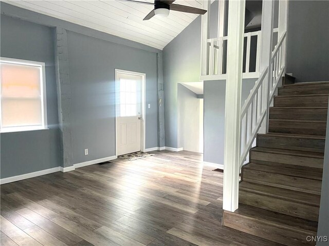 8807 N Main St, Le Ray, NY 13637 - foyer featuring ceiling fan, vaulted ceiling, stairs, wood finished floors, and baseboards