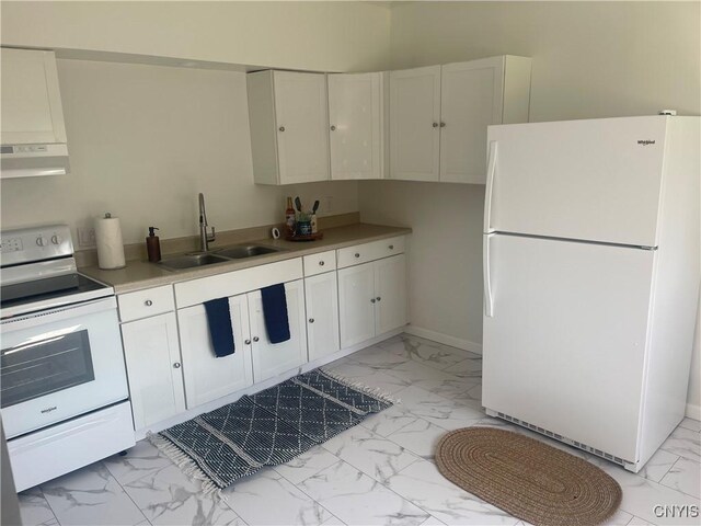 8807 N Main St, Le Ray, NY 13637 - kitchen featuring white appliances, light marble finish flooring, a sink, under cabinet range hood, and white cabinetry