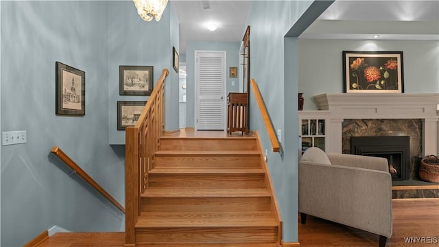 43 Larned Ln, Orchard Park, NY 14127 - stairs featuring wood finished floors and a premium fireplace