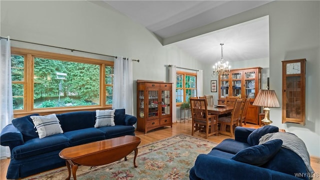 43 Larned Ln, Orchard Park, NY 14127 - living area with a chandelier, wood finished floors, and high vaulted ceiling