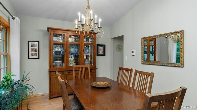 43 Larned Ln, Orchard Park, NY 14127 - dining space with a chandelier and light wood-style flooring