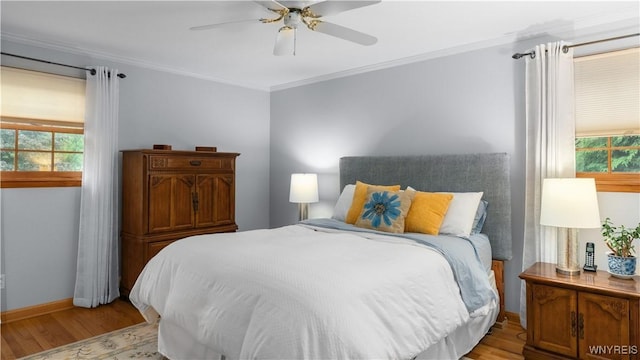 43 Larned Ln, Orchard Park, NY 14127 - bedroom with light wood-type flooring, crown molding, multiple windows, and a ceiling fan