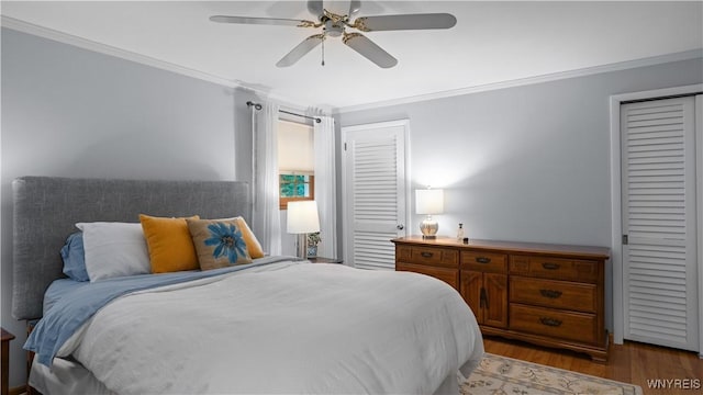 43 Larned Ln, Orchard Park, NY 14127 - bedroom with crown molding, light wood-type flooring, and ceiling fan