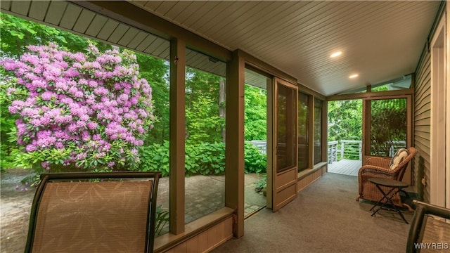 43 Larned Ln, Orchard Park, NY 14127 - unfurnished sunroom with vaulted ceiling, healthy amount of natural light, carpet floors, and recessed lighting