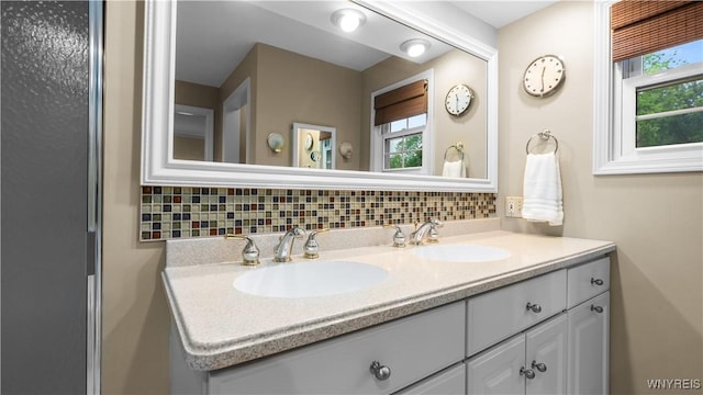 43 Larned Ln, Orchard Park, NY 14127 - bathroom with healthy amount of natural light, double vanity, and backsplash