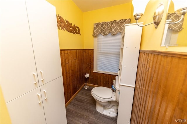 7750 State Route 812, New Bremen, NY 13367 - half bath featuring toilet, wooden walls, a wainscoted wall, and wood finished floors