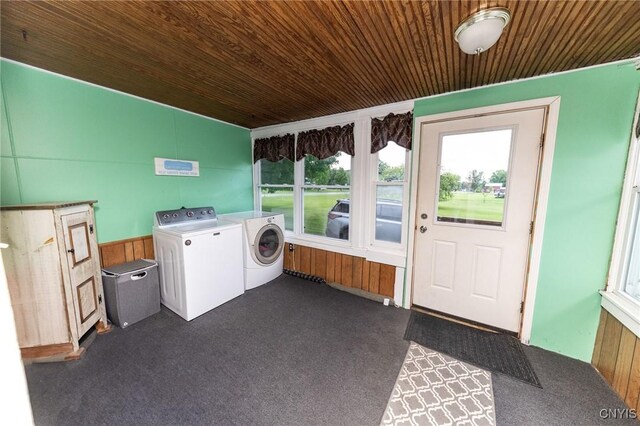 7750 State Route 812, New Bremen, NY 13367 - laundry room with washer and clothes dryer, wooden ceiling, dark carpet, and wood walls