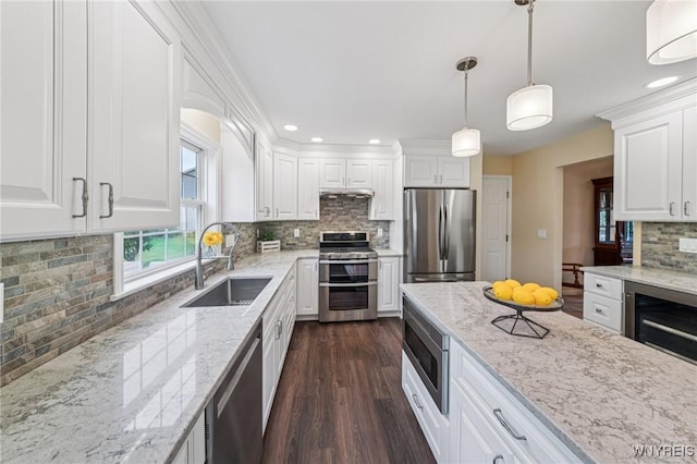 9377 Juniper Pl, Clarence, NY 14032 - kitchen with appliances with stainless steel finishes, a sink, decorative backsplash, white cabinetry, and dark wood finished floors