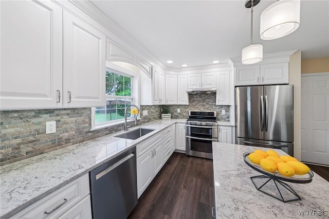 9377 Juniper Pl, Clarence, NY 14032 - kitchen featuring stainless steel appliances, a sink, white cabinetry, light stone counters, and recessed lighting