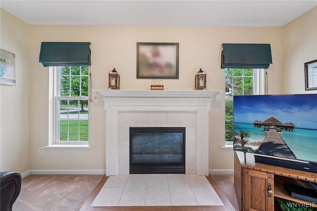 9377 Juniper Pl, Clarence, NY 14032 - carpeted living area with a tiled fireplace and baseboards