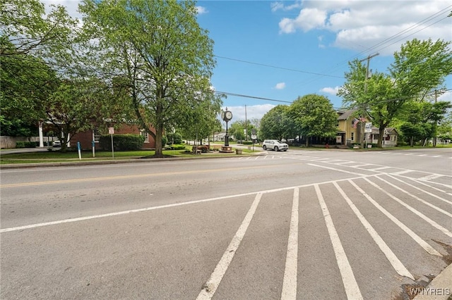 9377 Juniper Pl, Clarence, NY 14032 - view of asphalt road with traffic signs