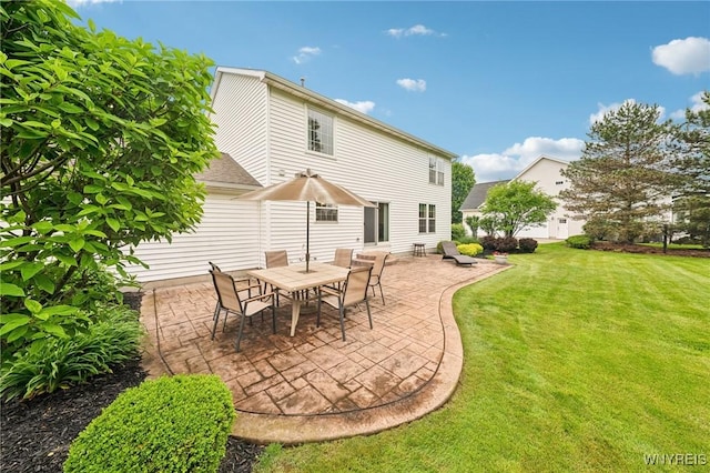 9377 Juniper Pl, Clarence, NY 14032 - back of property featuring a patio area and a lawn