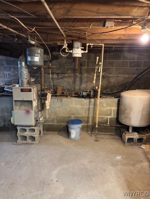 7491 S Grove Rd, Lyndon, NY 14737 - unfinished basement featuring a water pressure tank
