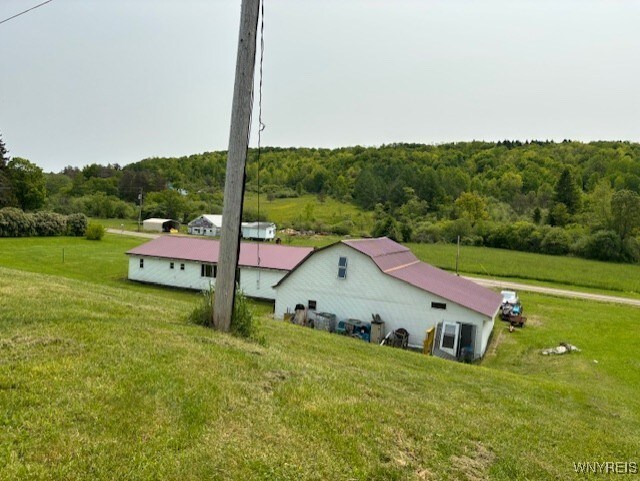 7491 S Grove Rd, Lyndon, NY 14737 - view of subject property featuring a forest