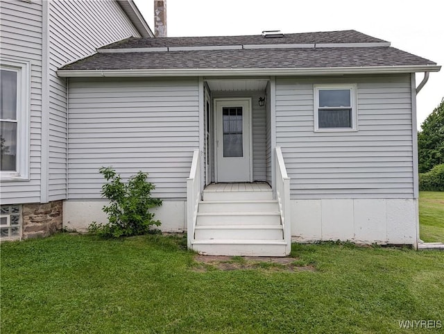 11131 Lakeshore Rd, Yates, NY 14098 - property entrance with roof with shingles and a lawn