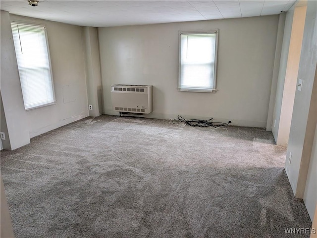 11131 Lakeshore Rd, Yates, NY 14098 - unfurnished room with heating unit and carpet flooring