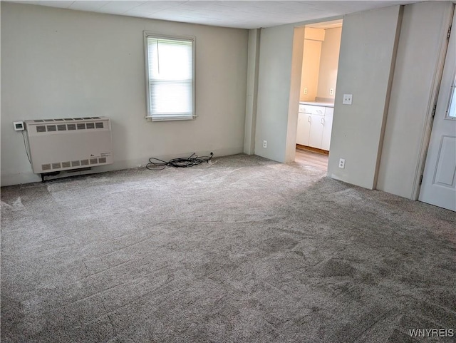 11131 Lakeshore Rd, Yates, NY 14098 - spare room featuring heating unit and carpet