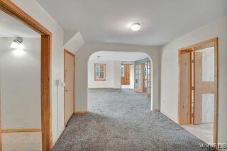 3271 Rte 78, Wethersfield, NY 14024 - hallway featuring arched walkways and carpet flooring