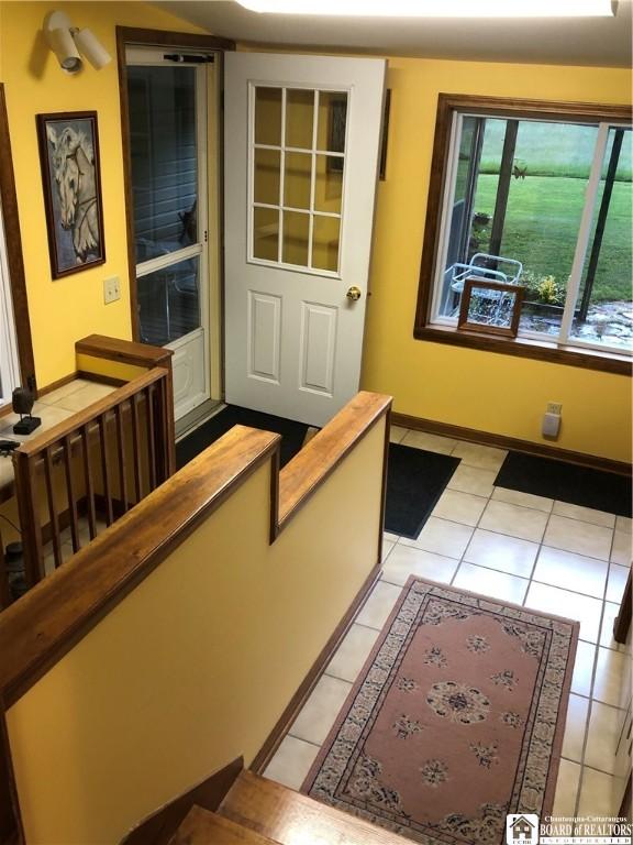 2898 Whitaker Rd, Sheridan, NY 14063 - entrance foyer featuring light tile patterned floors and baseboards