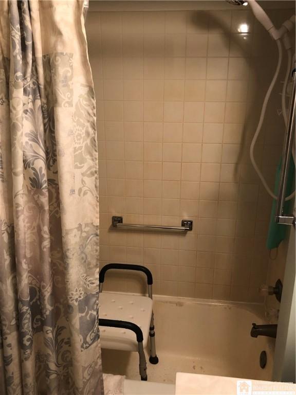 2898 Whitaker Rd, Sheridan, NY 14063 - bathroom with shower / bathtub combination with curtain