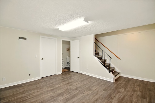 116 Surrey Hill Way, Henrietta, NY 14623 - finished basement with wood finished floors, a textured ceiling, stairway, and baseboards