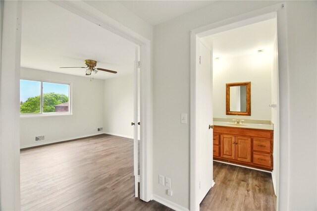 116 Surrey Hill Way, Henrietta, NY 14623 - spare room featuring dark wood-type flooring, ceiling fan, a sink, and baseboards