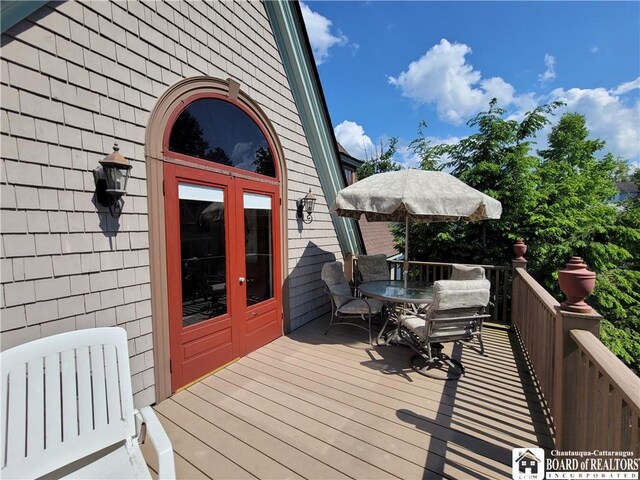 35 Miller Park, Chautauqua, NY 14722 - wooden deck with outdoor dining space and french doors