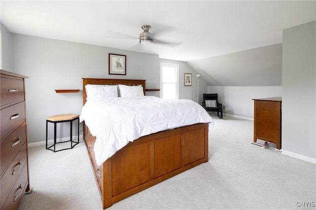 60 E Elizabeth St, Skaneateles, NY 13152 - bedroom with light colored carpet, vaulted ceiling, and ceiling fan