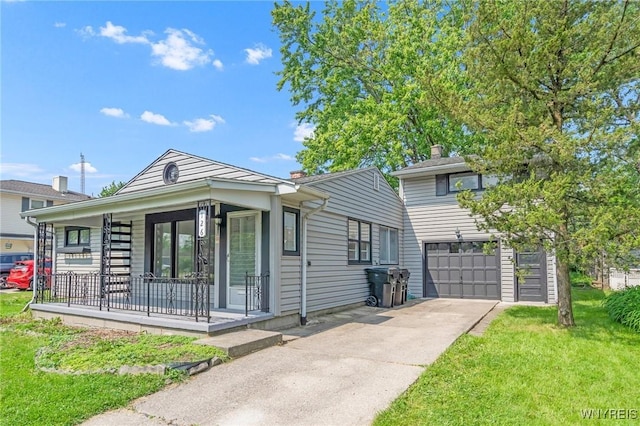 126 Pryor Ave, Tonawanda, NY 14150 - view of front facade featuring covered porch, a garage, driveway, and a front lawn