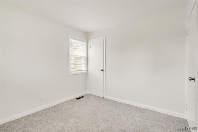 126 Pryor Ave, Tonawanda, NY 14150 - spare room with light colored carpet and baseboards