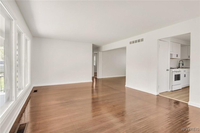 126 Pryor Ave, Tonawanda, NY 14150 - unfurnished living room with light wood-style floors
