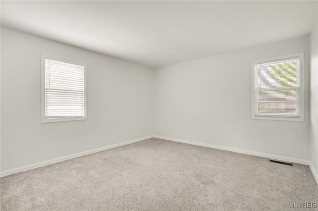 126 Pryor Ave, Tonawanda, NY 14150 - spare room featuring carpet flooring and baseboards