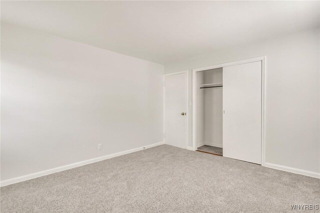 126 Pryor Ave, Tonawanda, NY 14150 - unfurnished bedroom with carpet floors and a closet