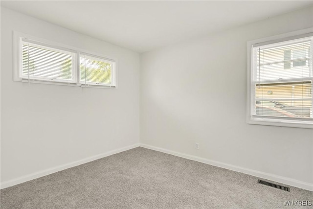 126 Pryor Ave, Tonawanda, NY 14150 - carpeted spare room featuring baseboards