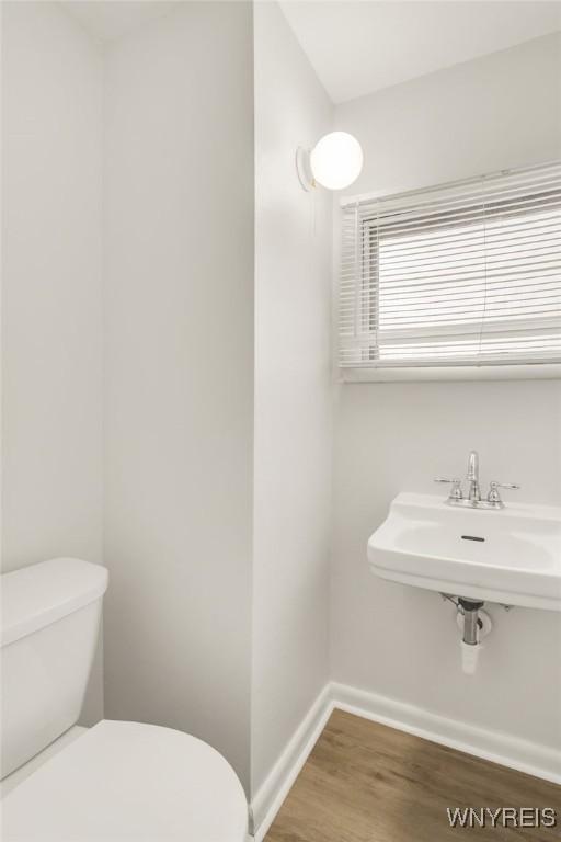 126 Pryor Ave, Tonawanda, NY 14150 - bathroom featuring toilet and wood finished floors