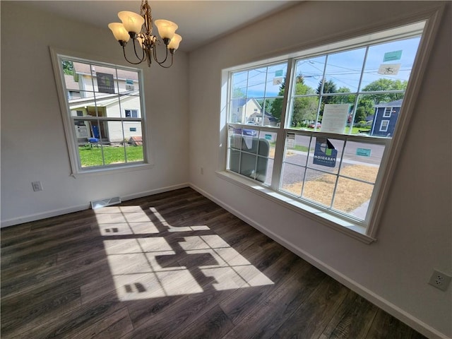 32 Jefferson St, North Dansville, NY 14437 - unfurnished room featuring a chandelier and dark wood-style flooring