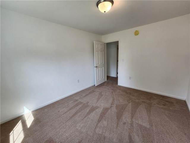 32 Jefferson St, North Dansville, NY 14437 - carpeted spare room with baseboards and a smoke detector