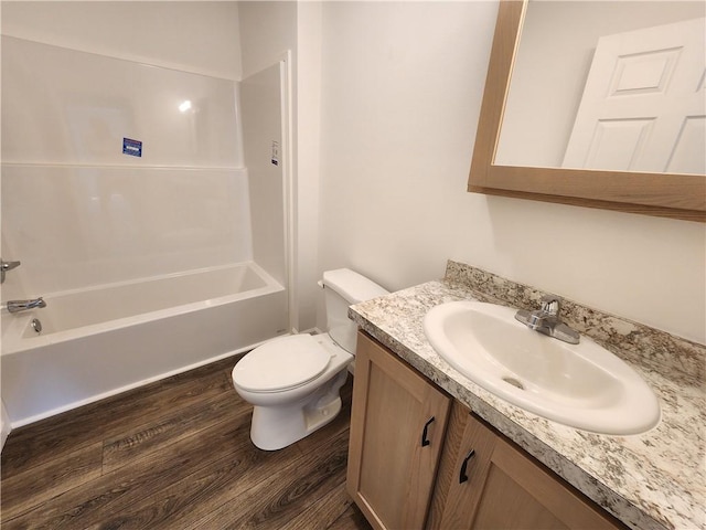 32 Jefferson St, North Dansville, NY 14437 - full bath featuring vanity, wood finished floors, and tub / shower combination
