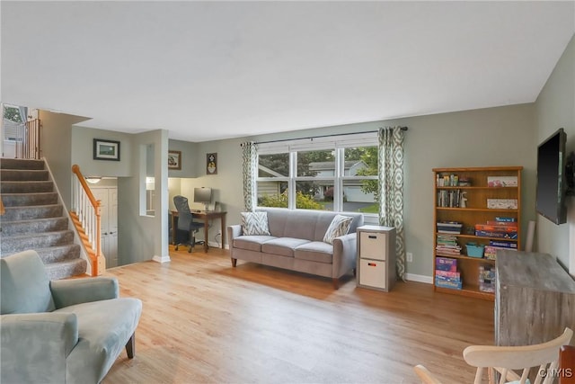 4330 Cinnamon Path, Clay, NY 13090 - living room with wood finished floors, stairs, and a desk
