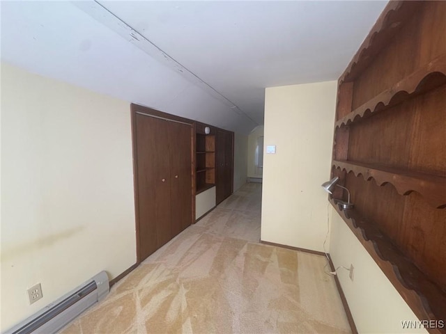 113 Hamilton St, Buffalo, NY 14207 - corridor featuring a baseboard radiator, lofted ceiling, and light colored carpet