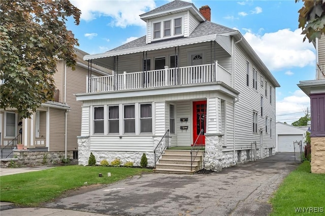 88 Rugby Rd, Buffalo, NY 14216 - american foursquare style home featuring a balcony, a chimney, an outbuilding, a detached garage, and a front yard