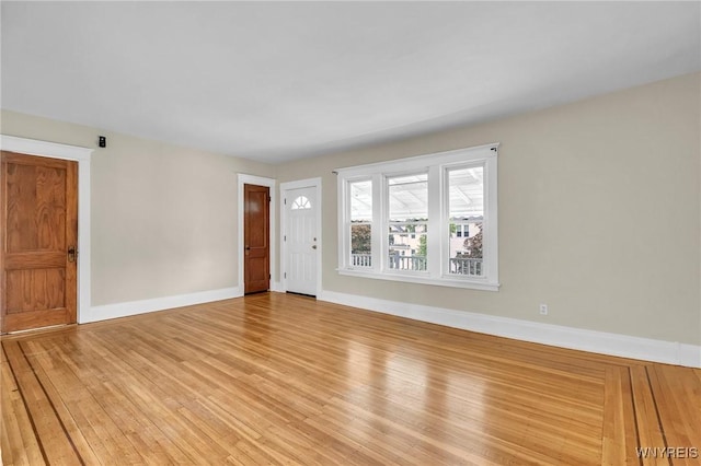 88 Rugby Rd, Buffalo, NY 14216 - unfurnished living room featuring light wood finished floors and baseboards