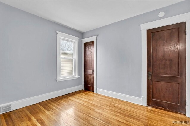 88 Rugby Rd, Buffalo, NY 14216 - unfurnished bedroom with baseboards and light wood-style floors